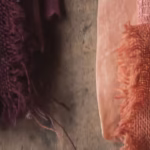 cotton linen fabrics and skeins of wool dyed purple and orange with banana twist